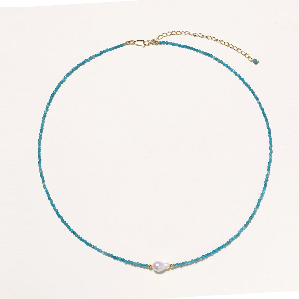 Delicate necklace featuring small turquoise apatite beads with a central freshwater pearl on sterling silver chain