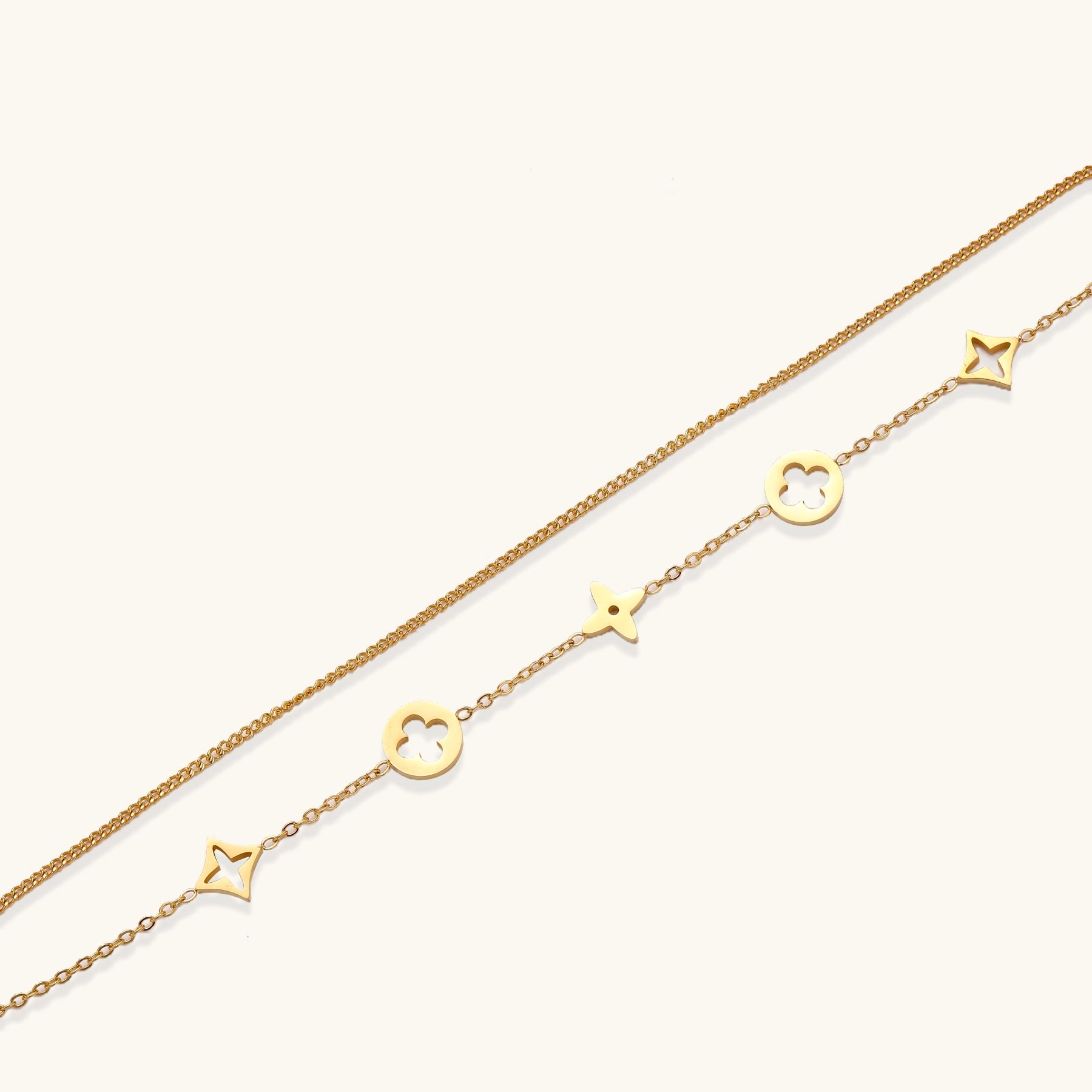 Dainty gold-plated bracelet with star and clover charms on double chain with adjustable extender
