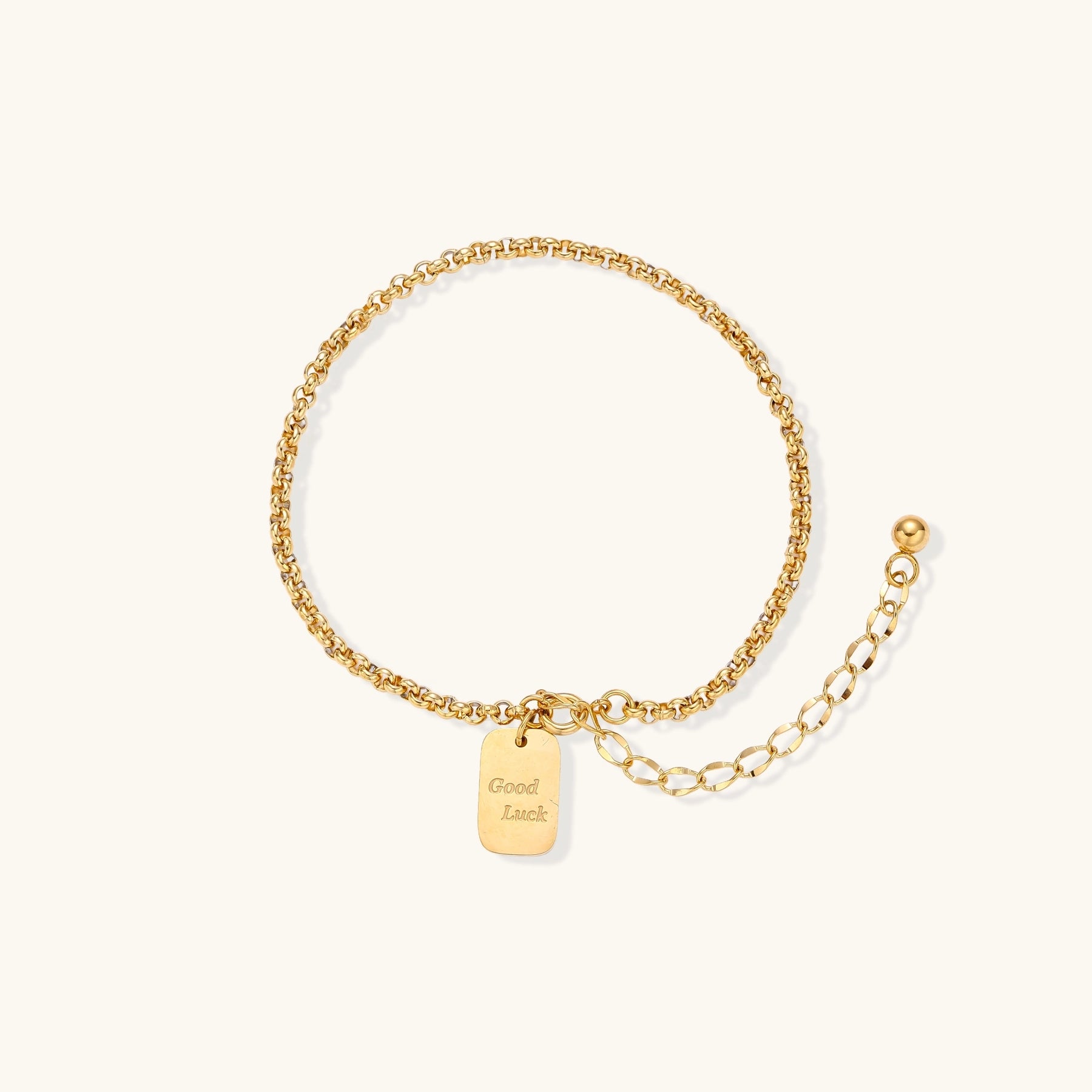 Minimalist gold-plated stainless steel chain bracelet with rectangular 'Good Luck' charm and adjustable extension