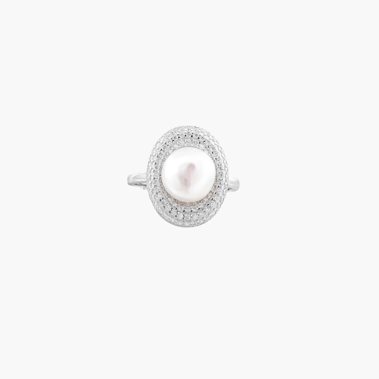 Silver ring with lustrous white pearl center surrounded by sparkling crystal halo on light background.