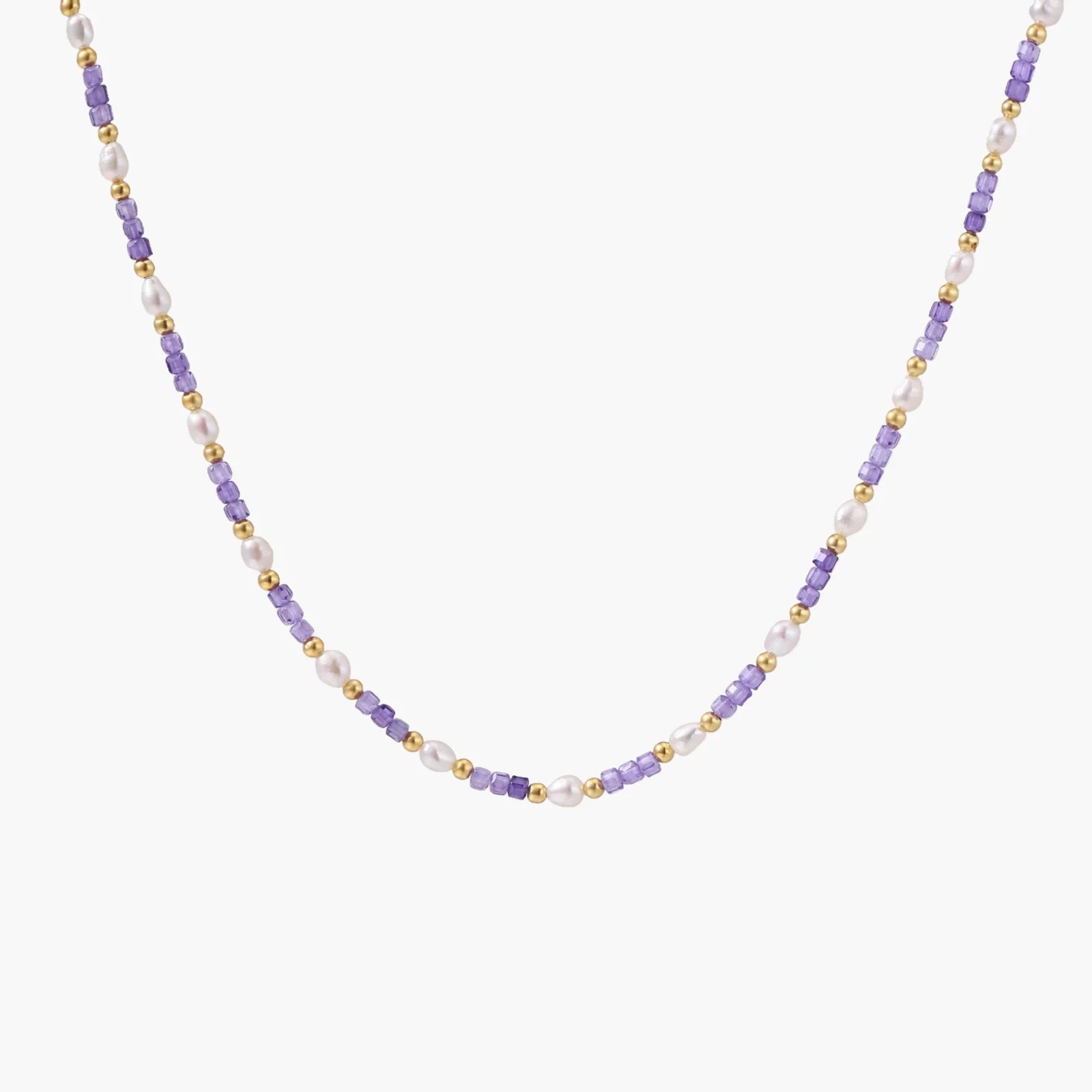Delicate 18K gold vermeil necklace with alternating lavender zirconia beads and white freshwater pearls on cream background
